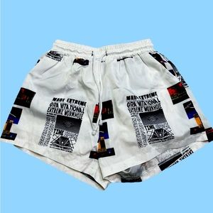Trendy white newspaper print shorts